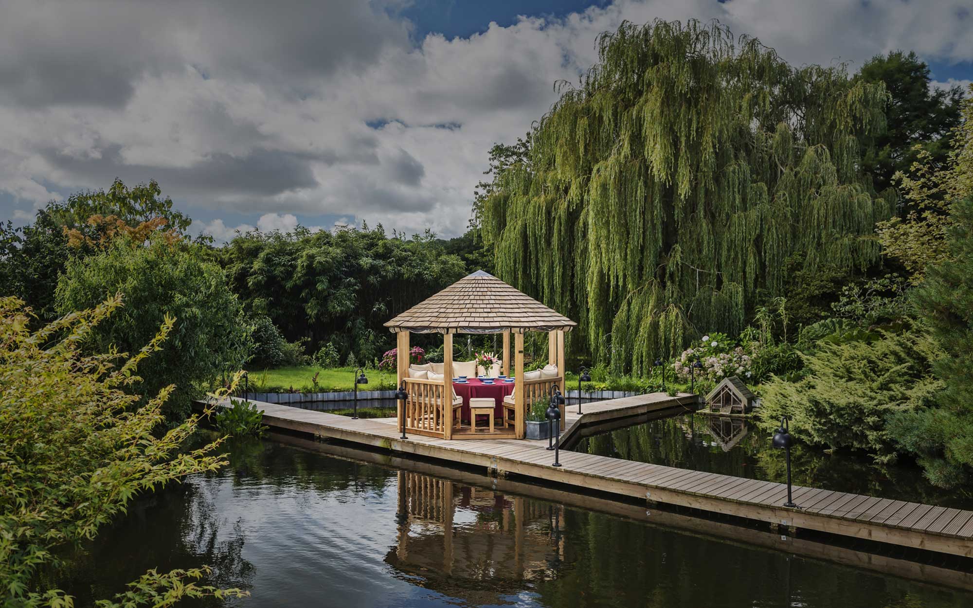 Luxury wooden gazebo in garden setting