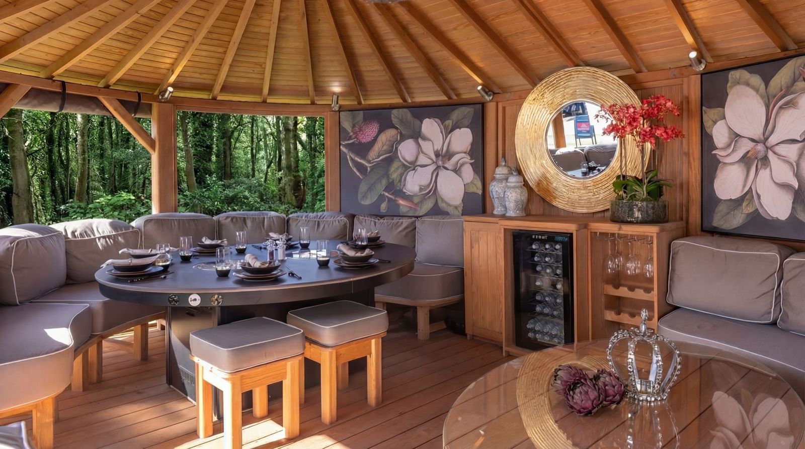 Crown Pavilions Smokeless BBQ integrated into an oval dining table inside a wooden gazebo