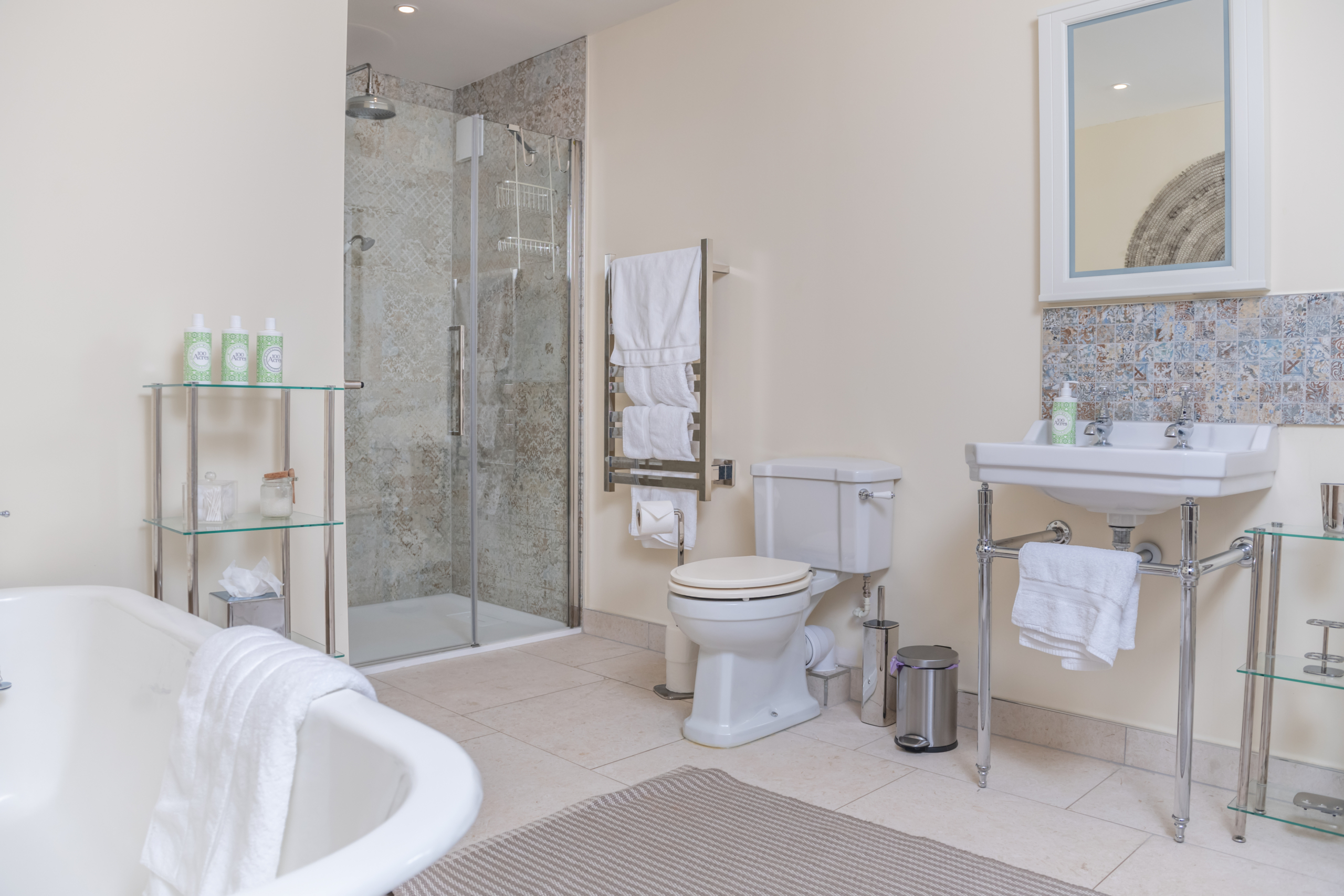 Bathroom with toilet, sink, bath and shower facilities