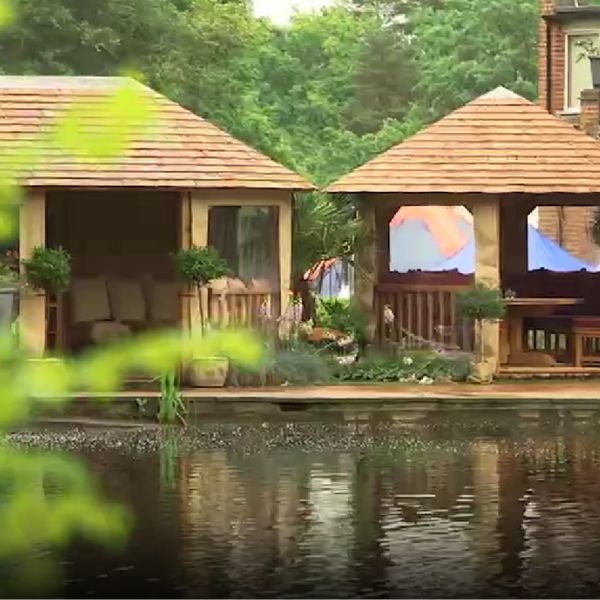 Garden room behind pond